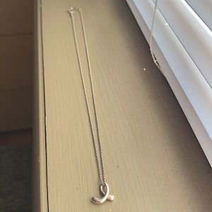 Selling this Tiffany and Co “e” necklace
